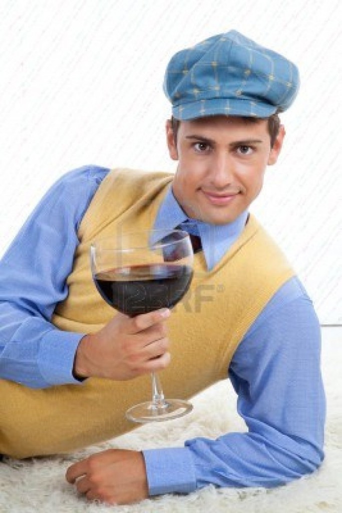 15101147-man-with-large-wine-glass-leaning-on-rug